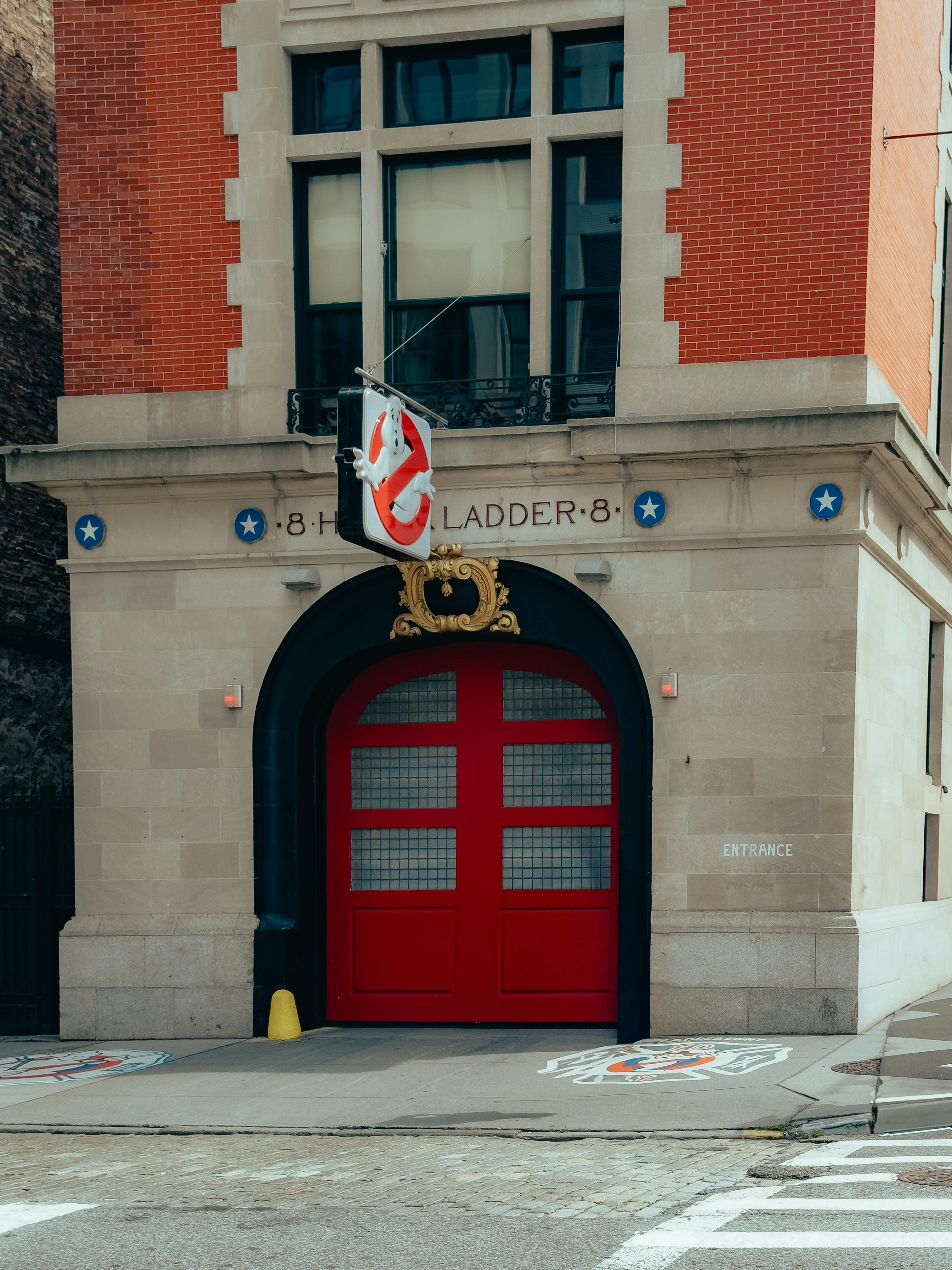 A red door on the side of a building