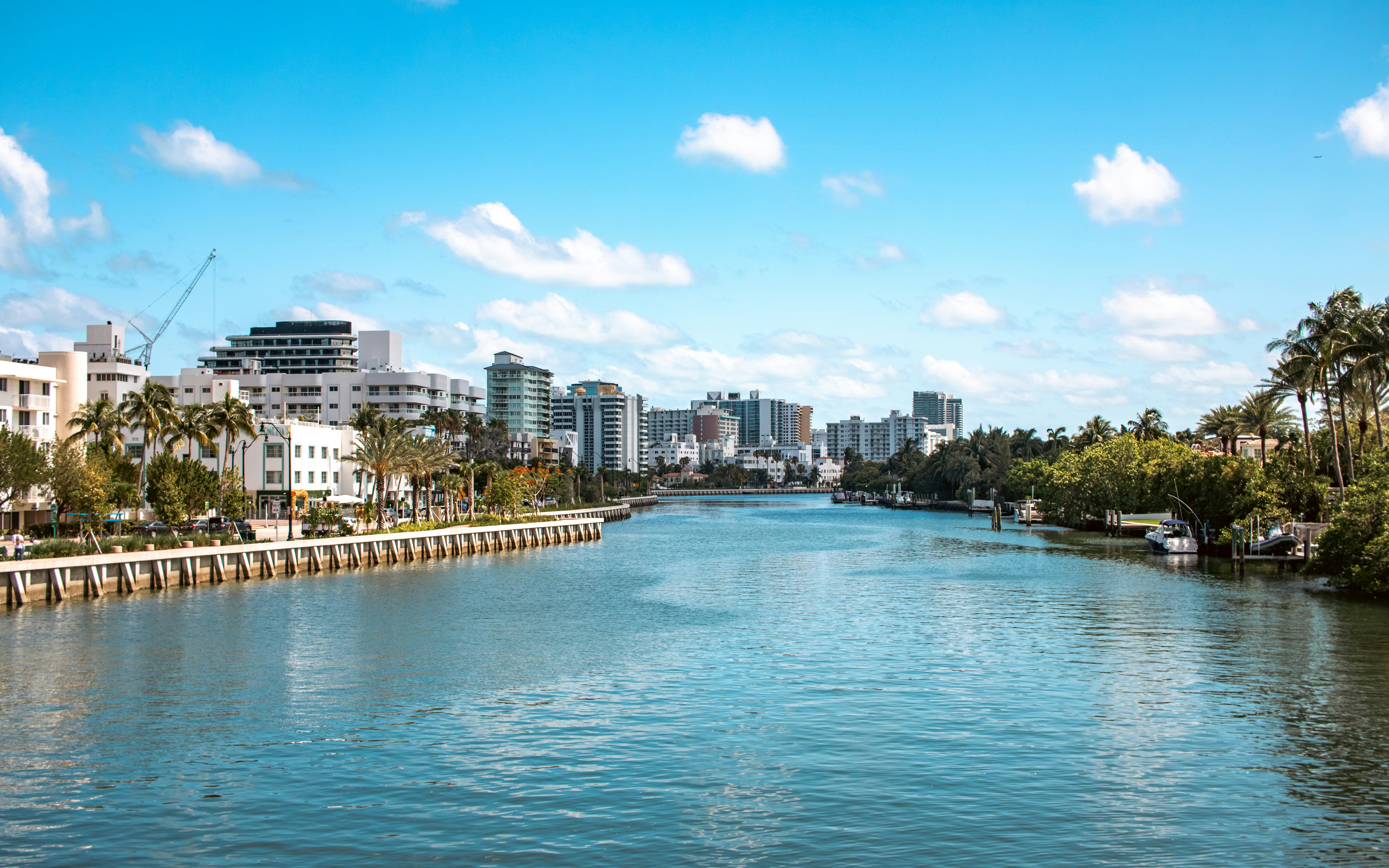 A river running through a city next to tall buildings