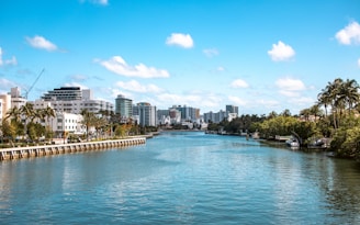 A river running through a city surrounded by tall buildings