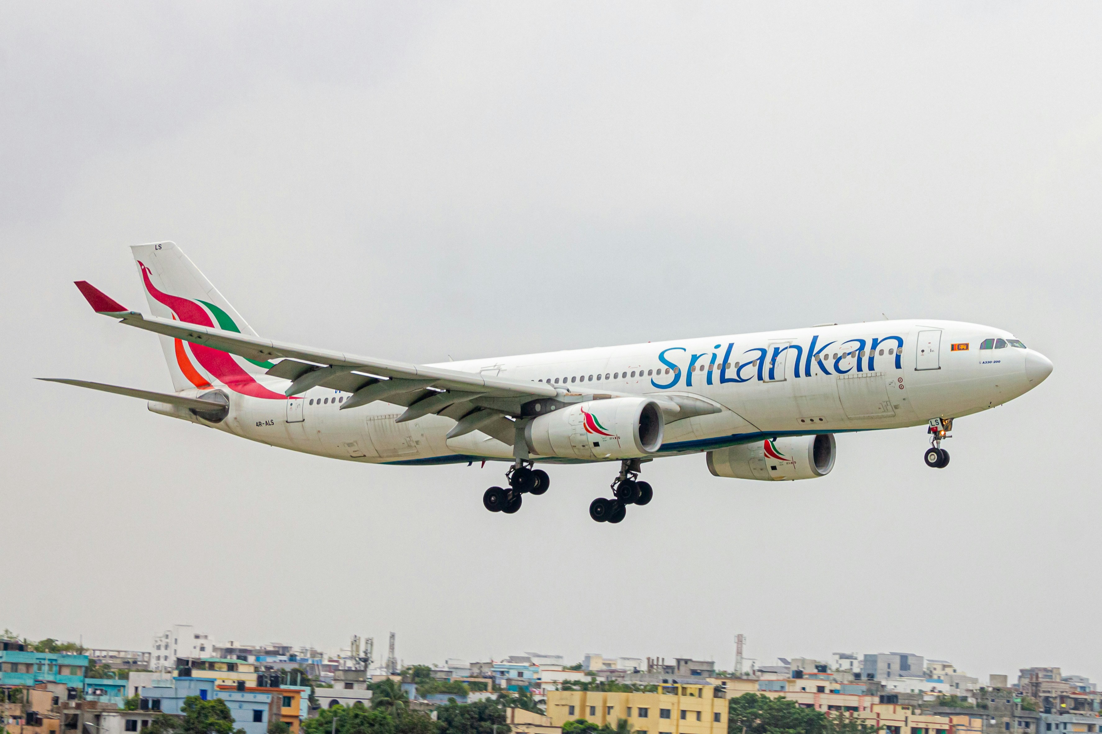 A large jetliner flying through a cloudy sky, SRILANKAN AIRLINES AIRBUS A330-300 ✨