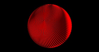 A red traffic light on a black background