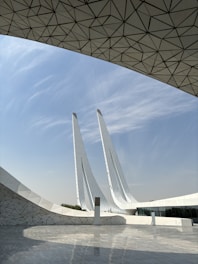 A large white building with a sky background