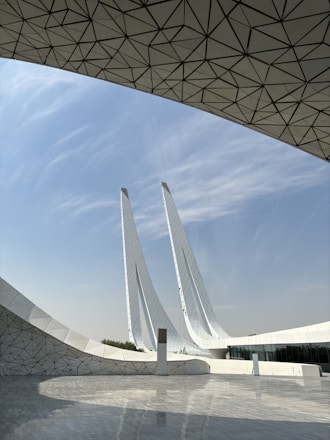 A large white building with a sky background