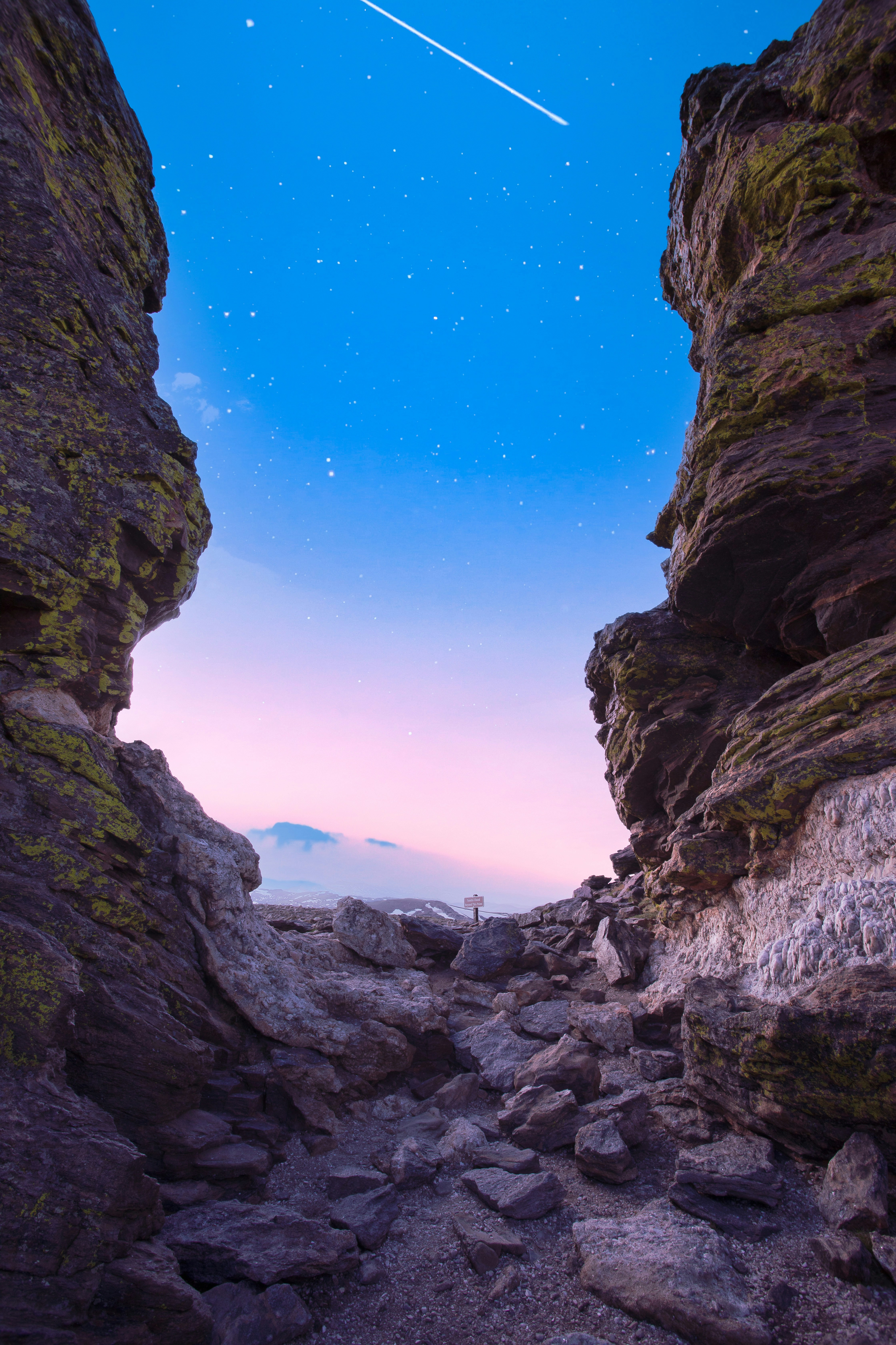 A view of the sky from between two rocks