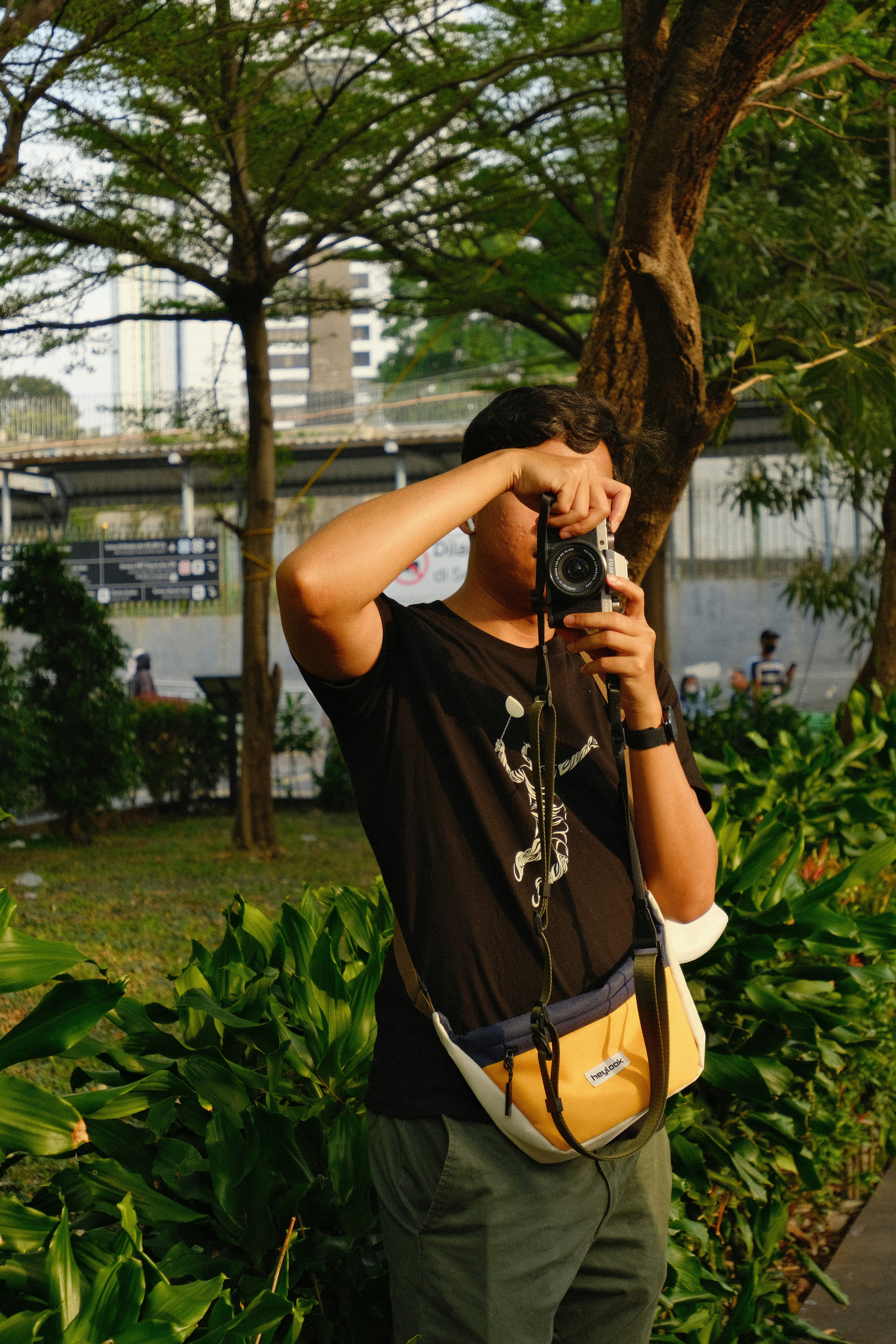A man taking a picture of himself with a camera