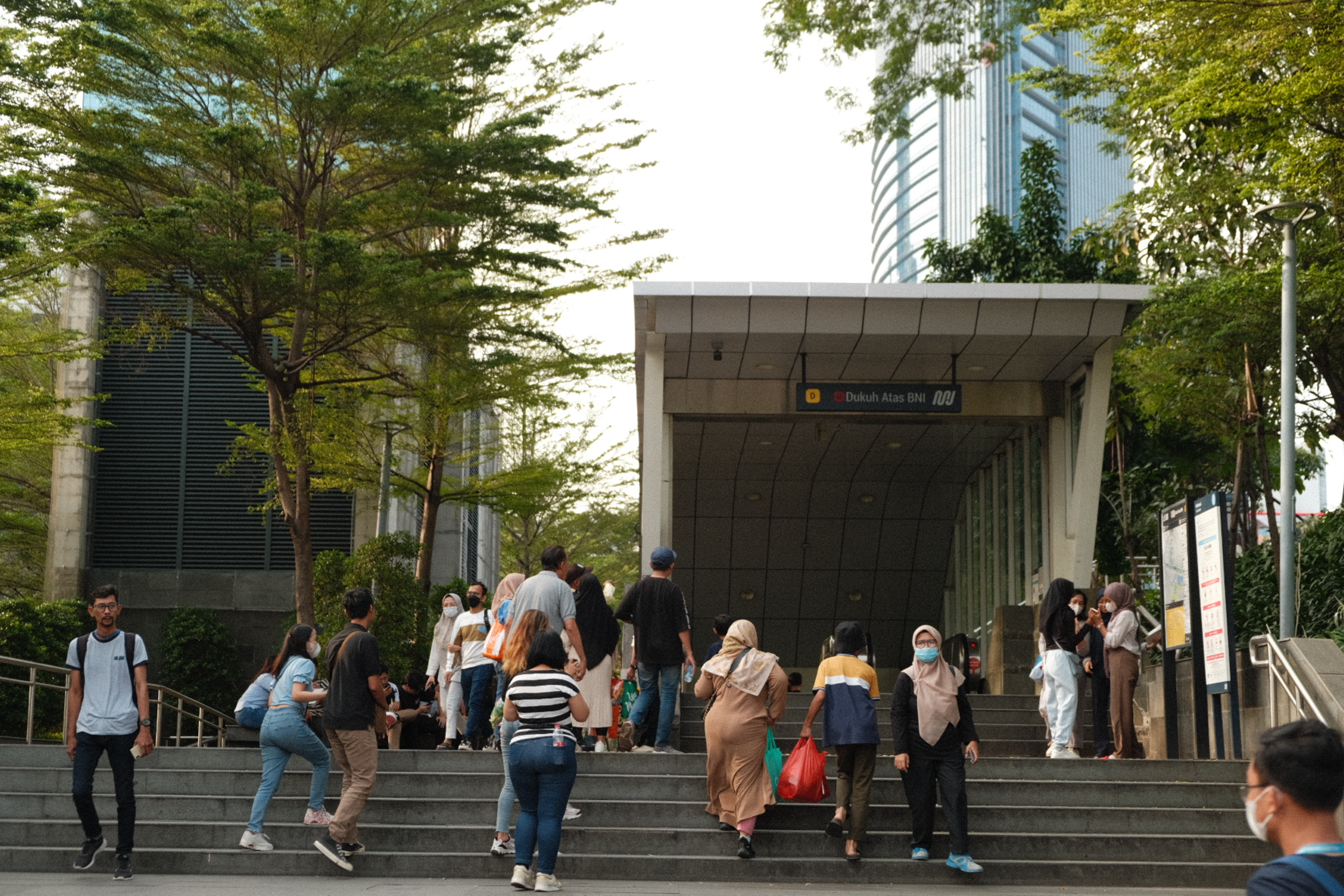 A group of people walking up a flight of stairs
