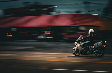 A person riding a motorcycle on a city street