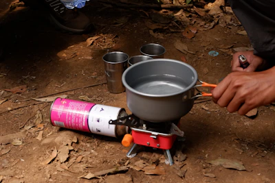 A person is preparing food on a stove
