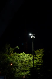 A street light is lit up at night