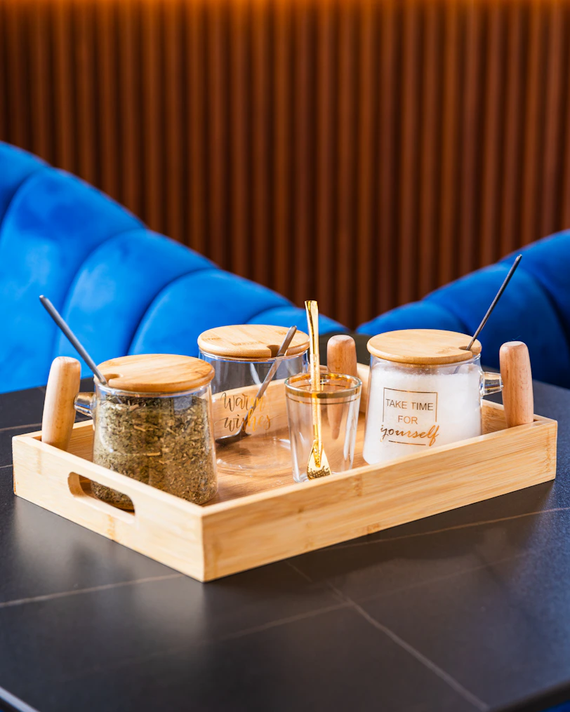 A tray with spices on a table in a restaurant