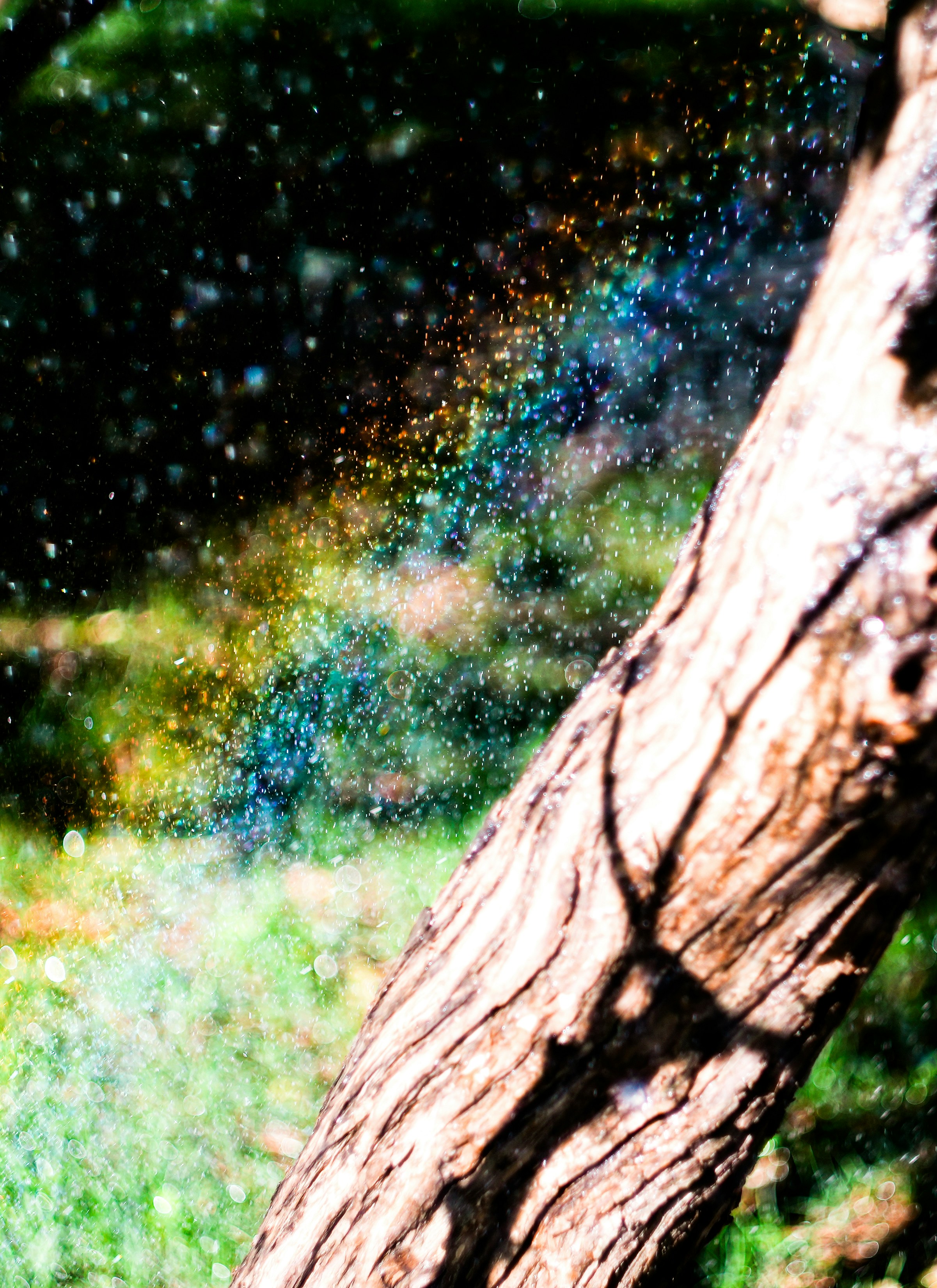 A fire hydrant spewing water out of it's spout