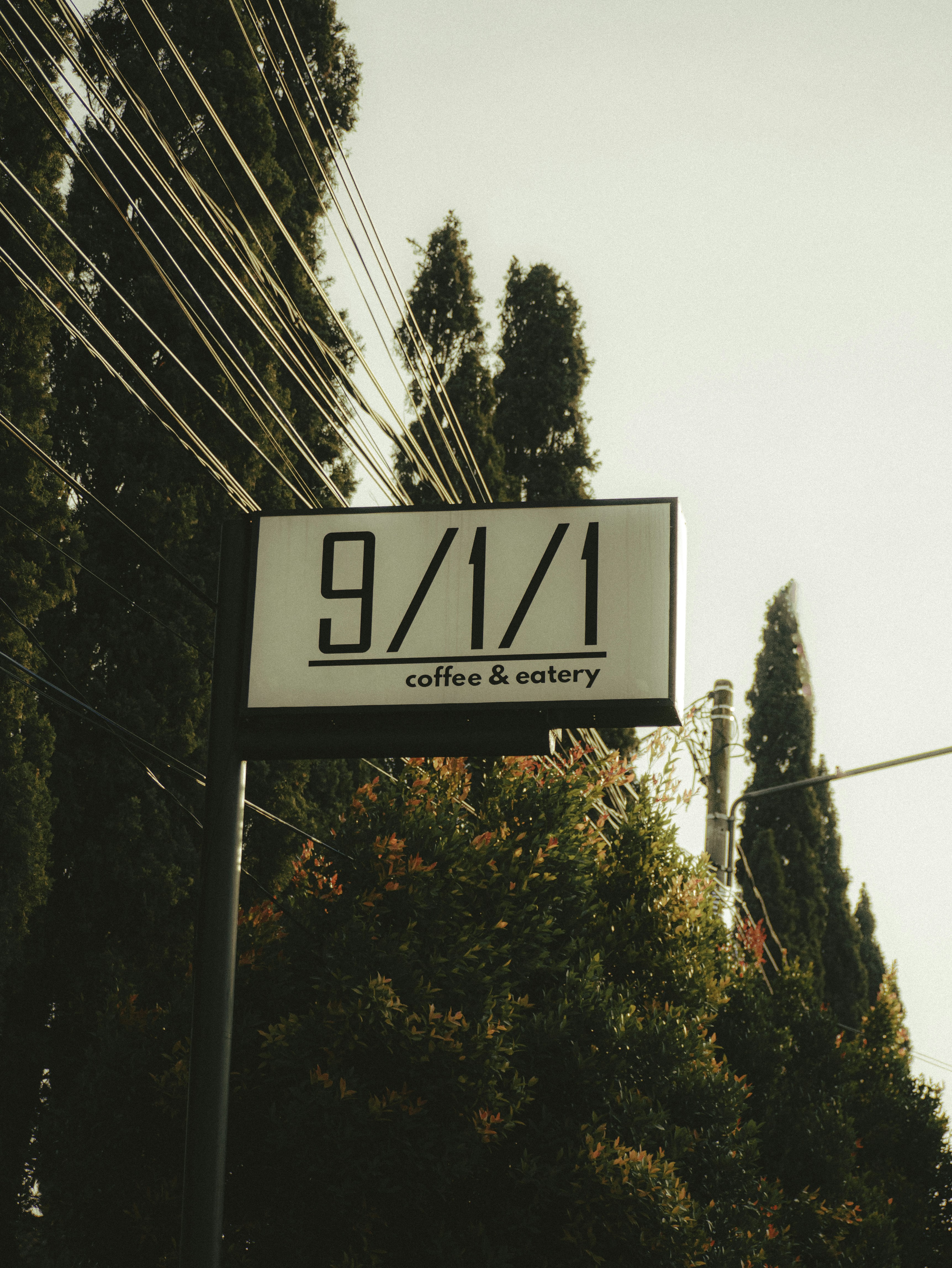 A street sign on the side of a road photo – Free City Image on Unsplash