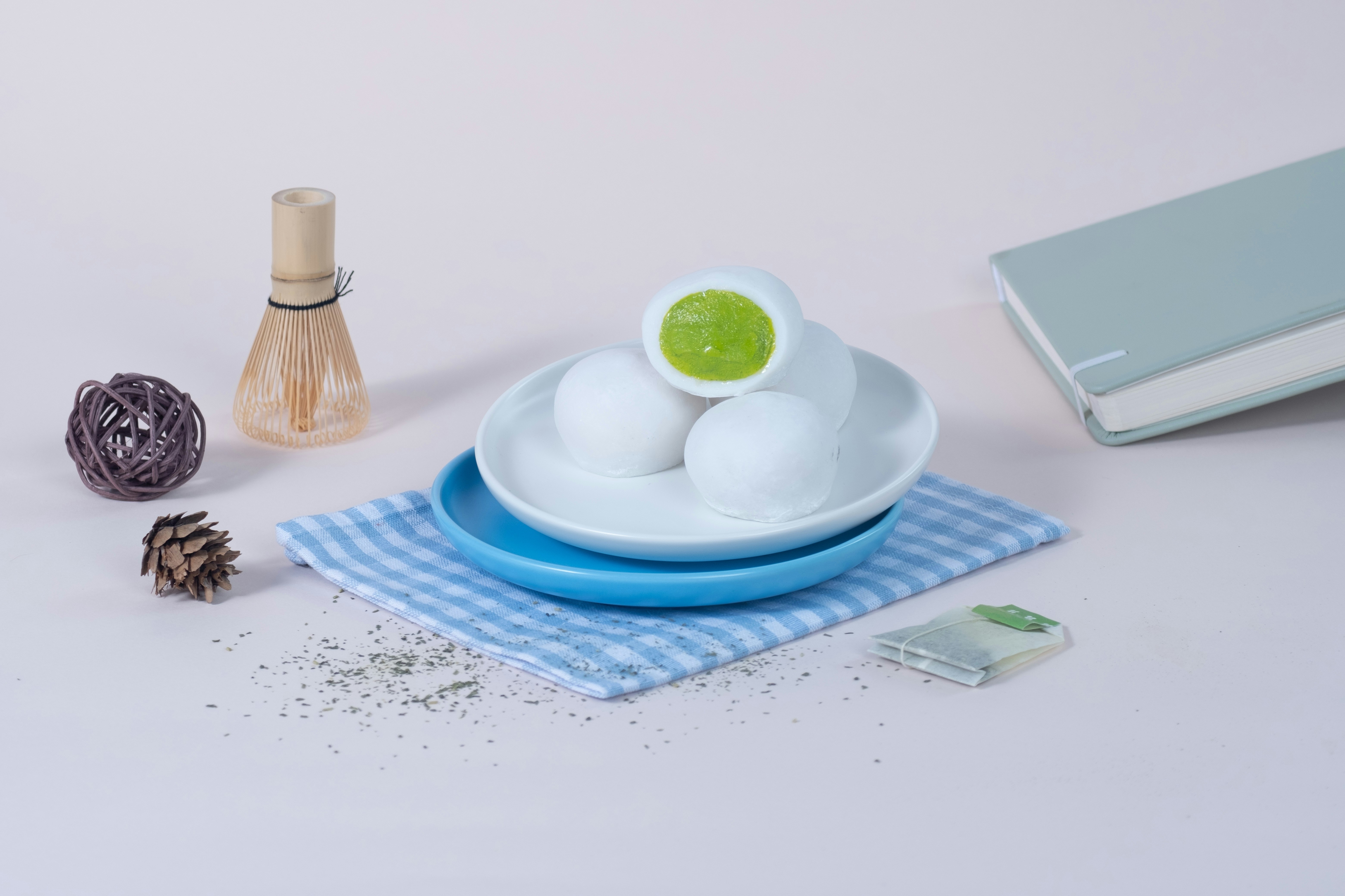 A white plate topped with eggs next to a book, 