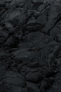 A close up of rocks with a sky in the background