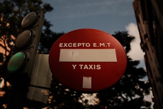 A traffic light that has a red sign on it