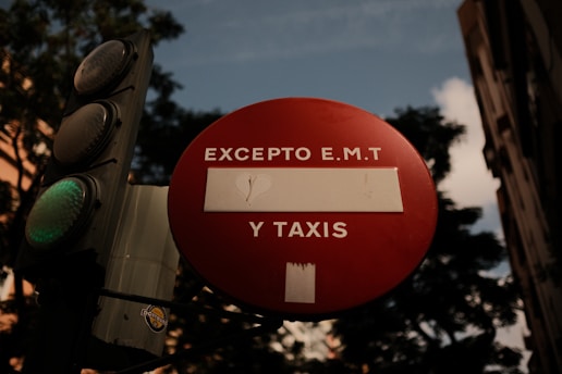 A traffic light that has a red sign on it