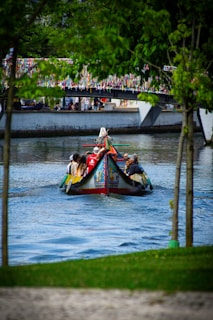 A group of people riding on top of a colorful boat