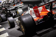 A close up of a race car on display