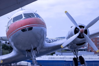 A propeller plane sitting on top of a tarmac