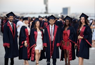 A group of people in graduation gowns posing for a picture