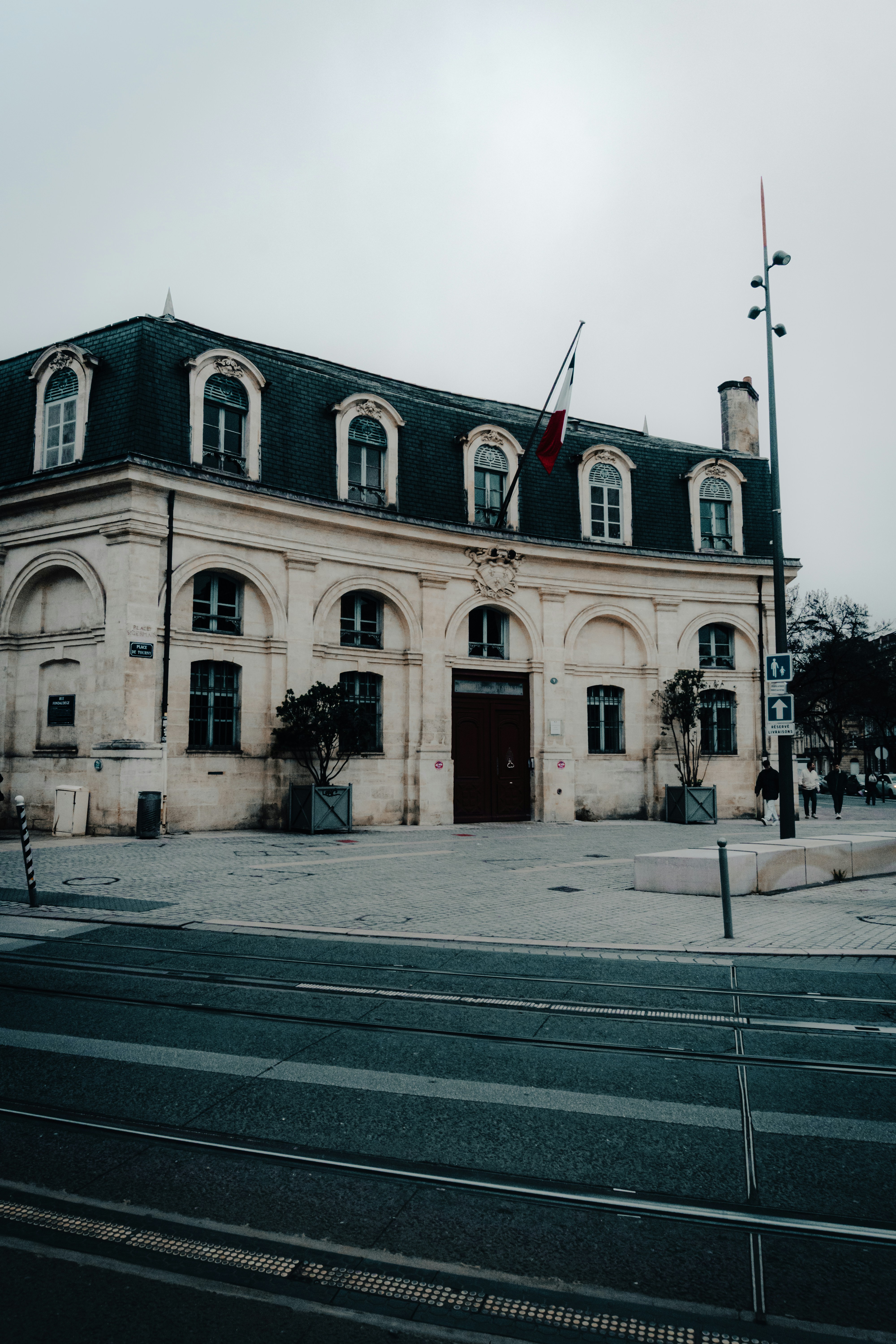 A large building with a flag on top of it