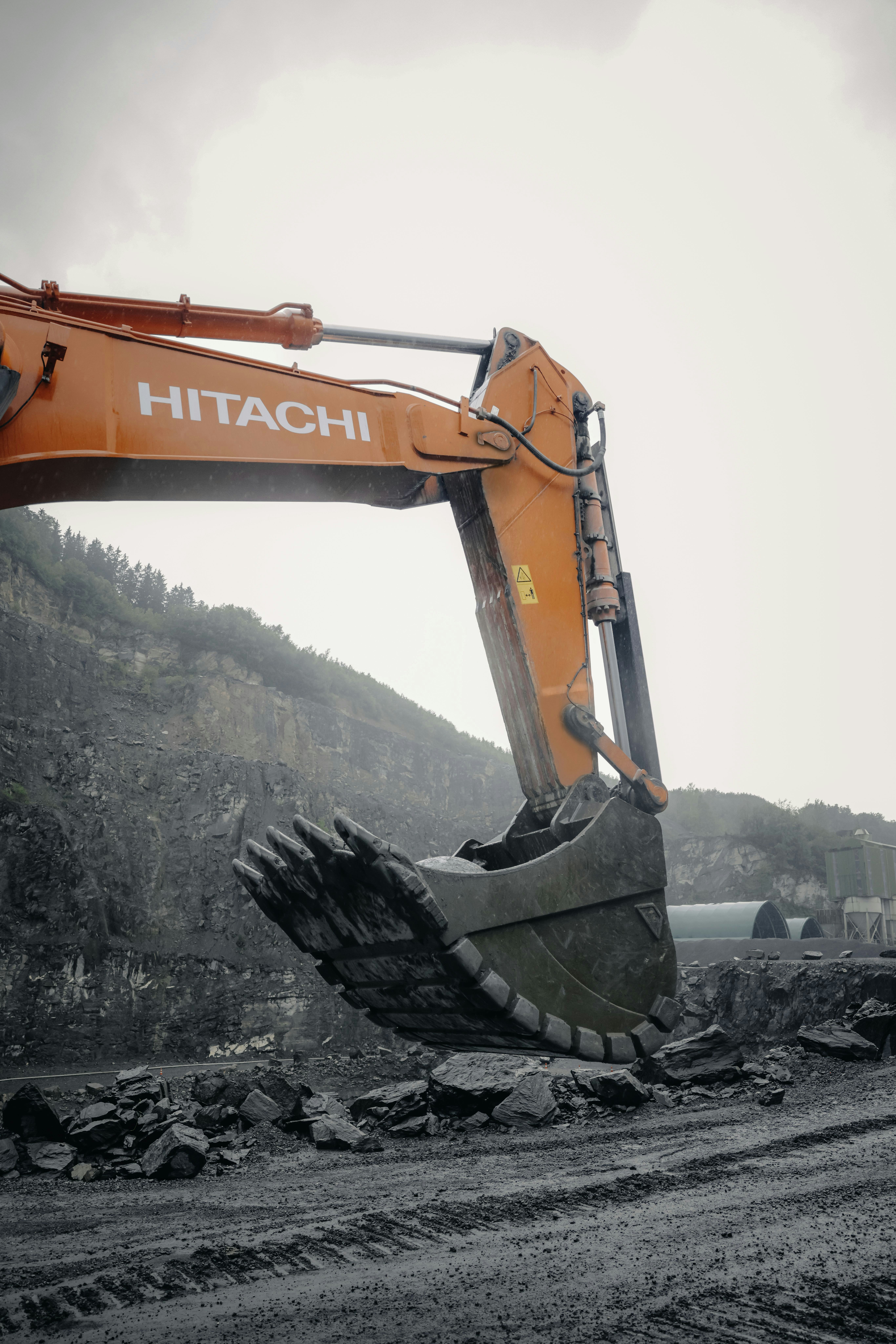 A large excavator digging a dirt road