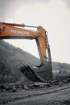 A large excavator digging a dirt road