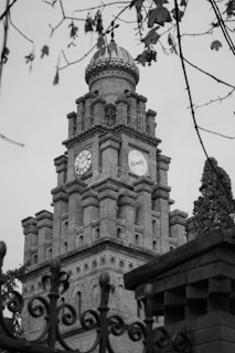 A black and white photo of a clock tower