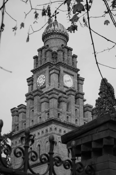 A black and white photo of a clock tower