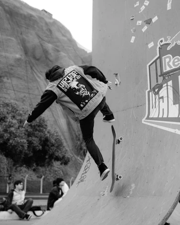 A man riding a skateboard up the side of a ramp