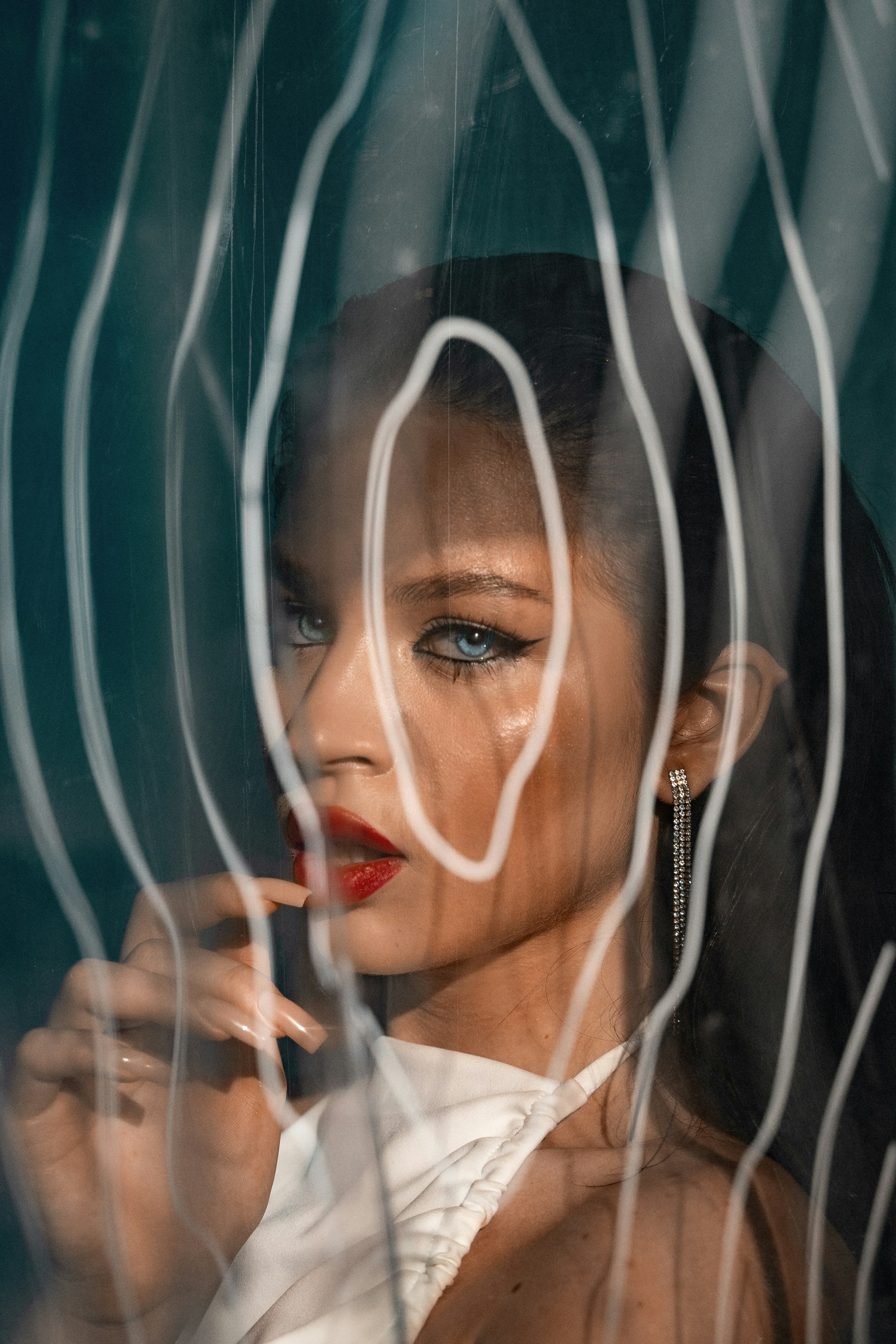 A woman looking out of a window at something
