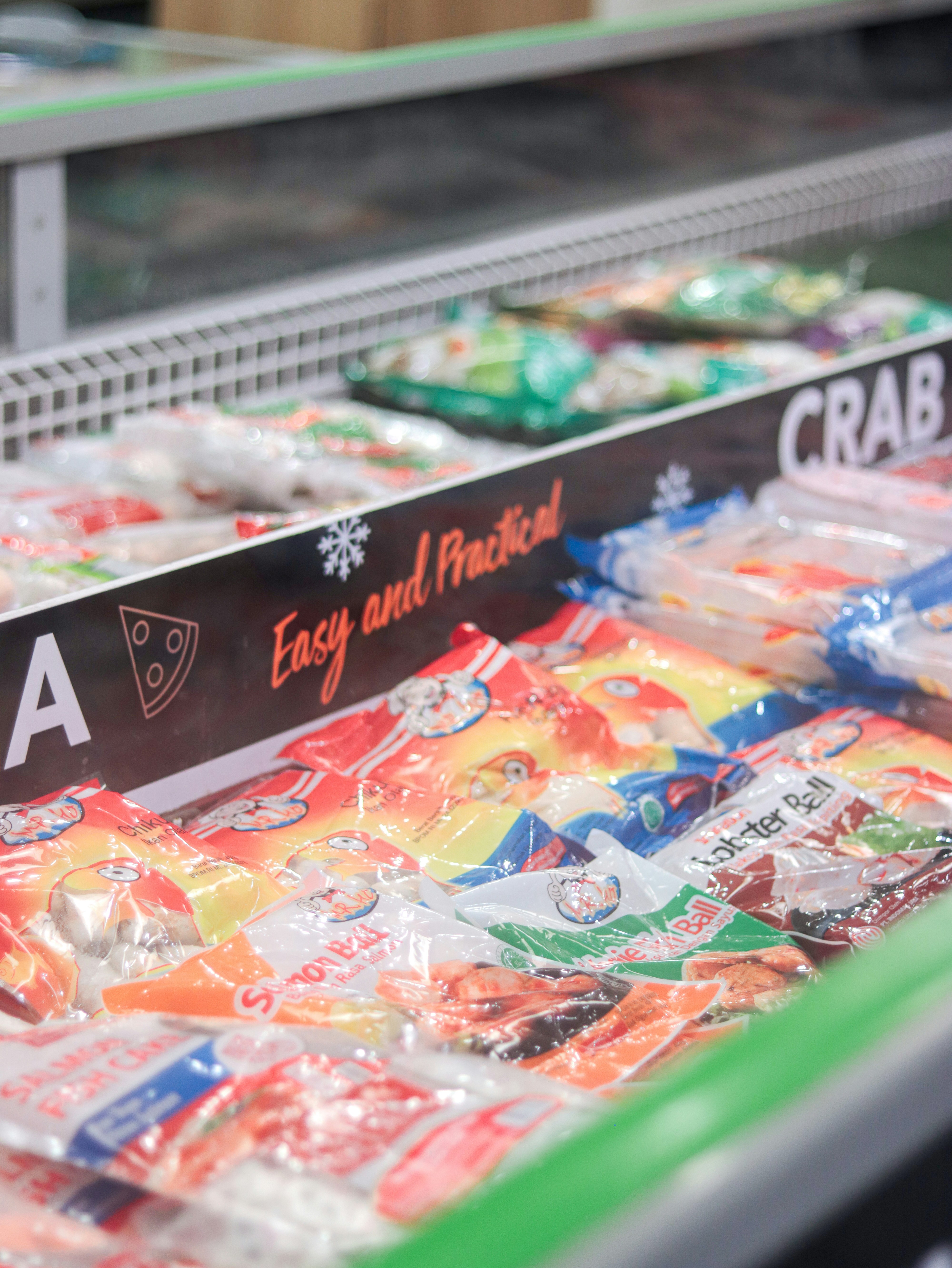 A display case in a grocery store filled with candy