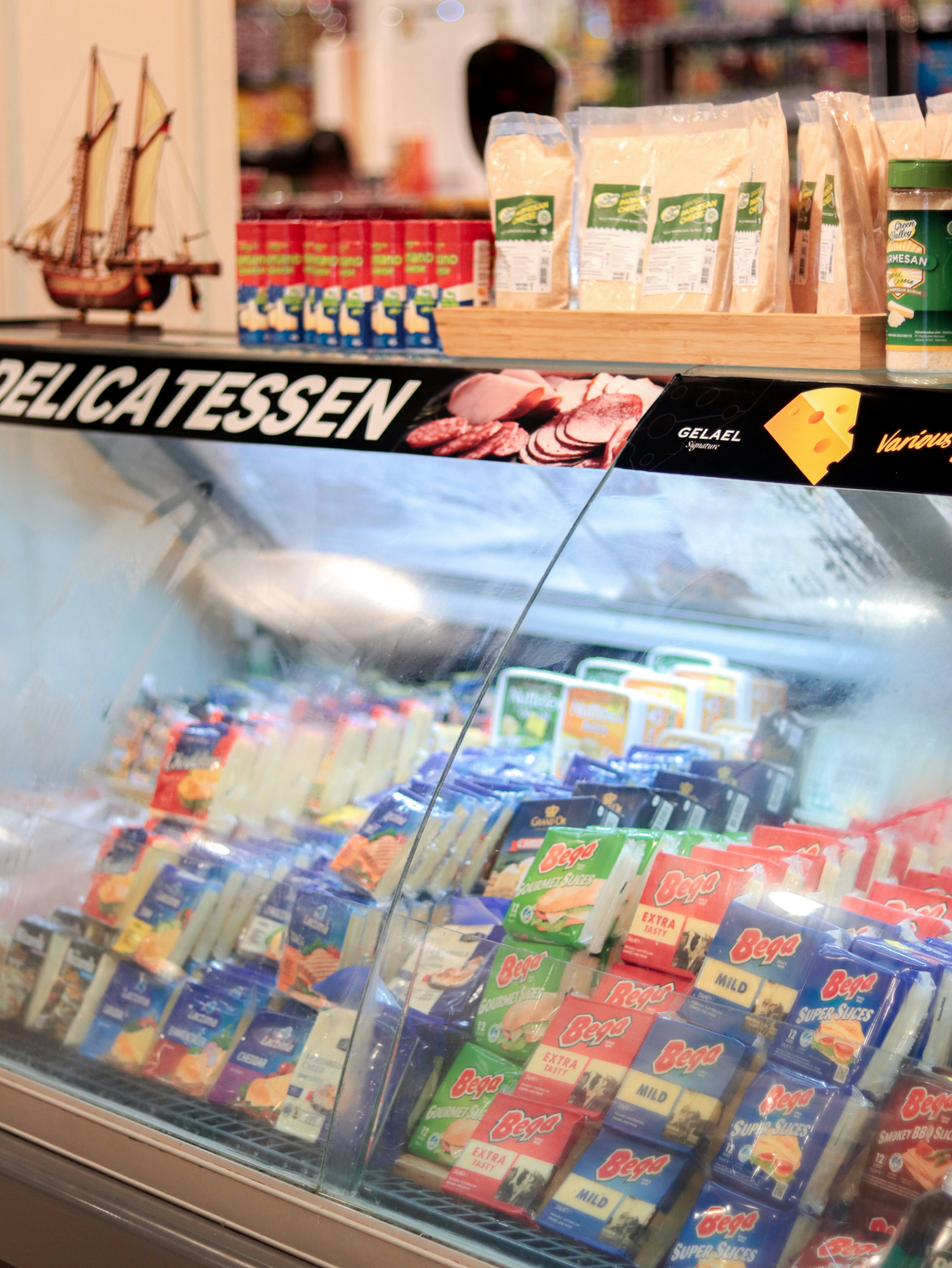A display case in a store filled with lots of food