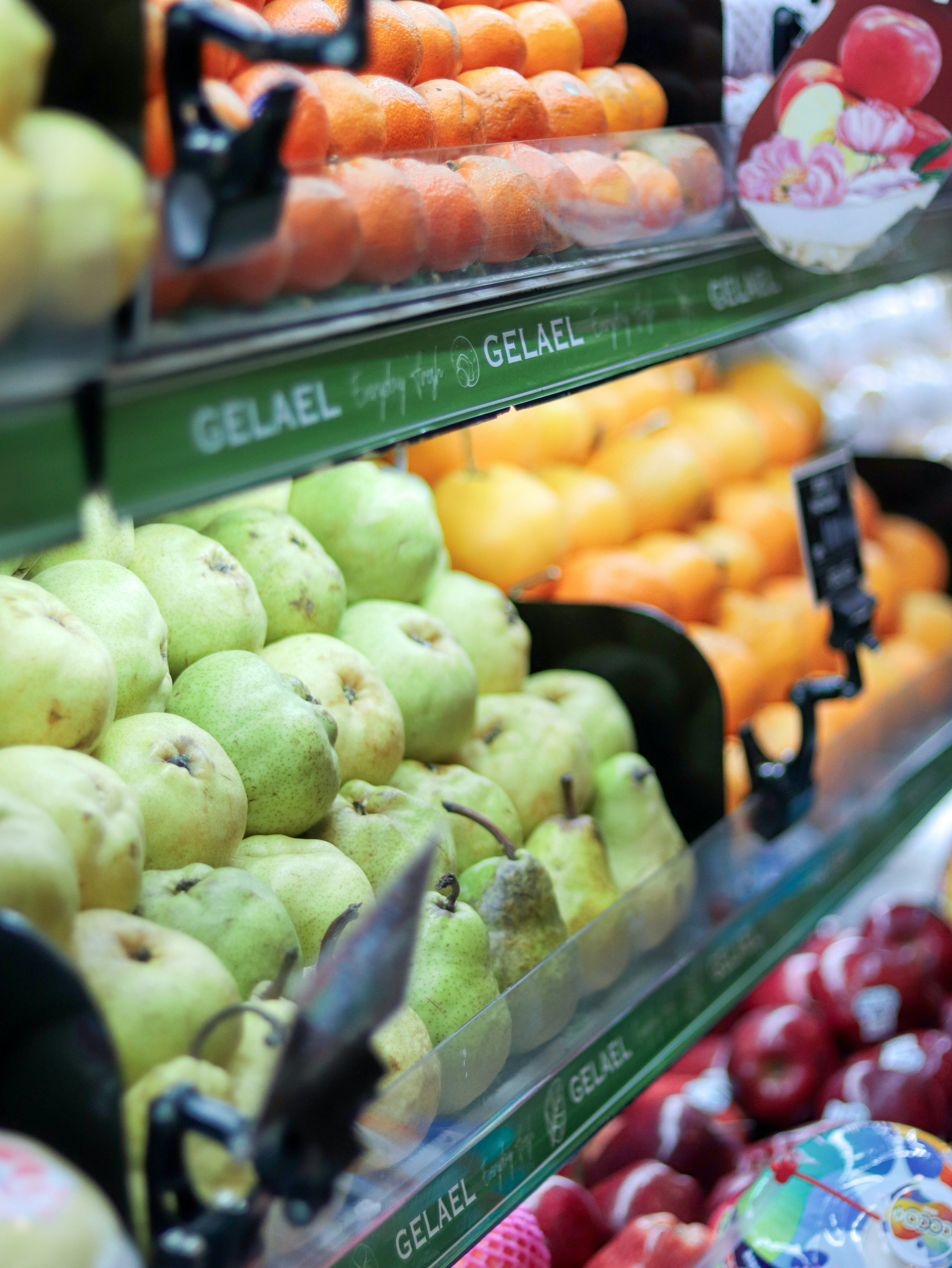 A display in a grocery store filled with lots of fruits