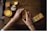 A person sitting at a table with a cell phone
