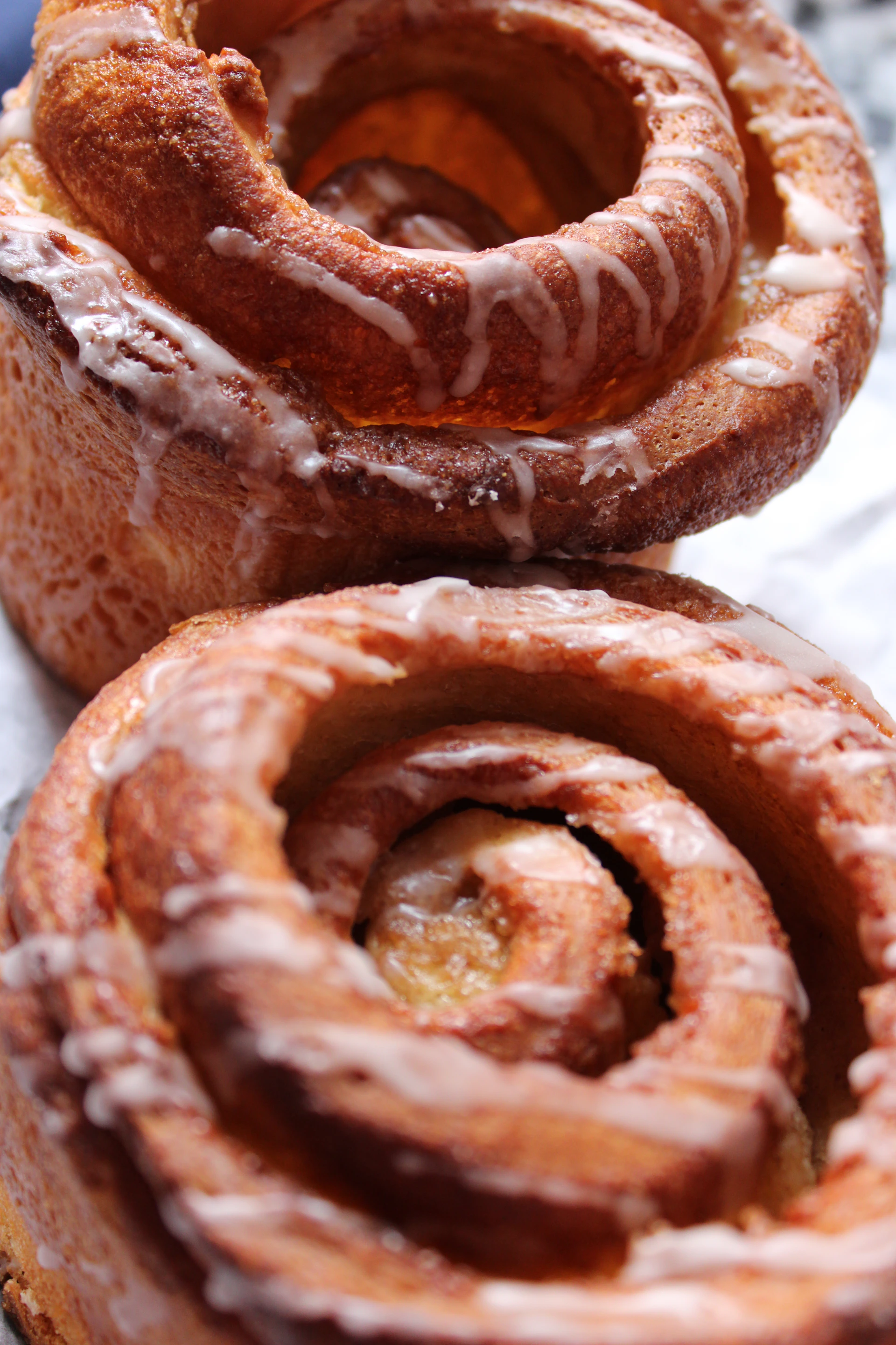 A couple of doughnuts sitting on top of a table
