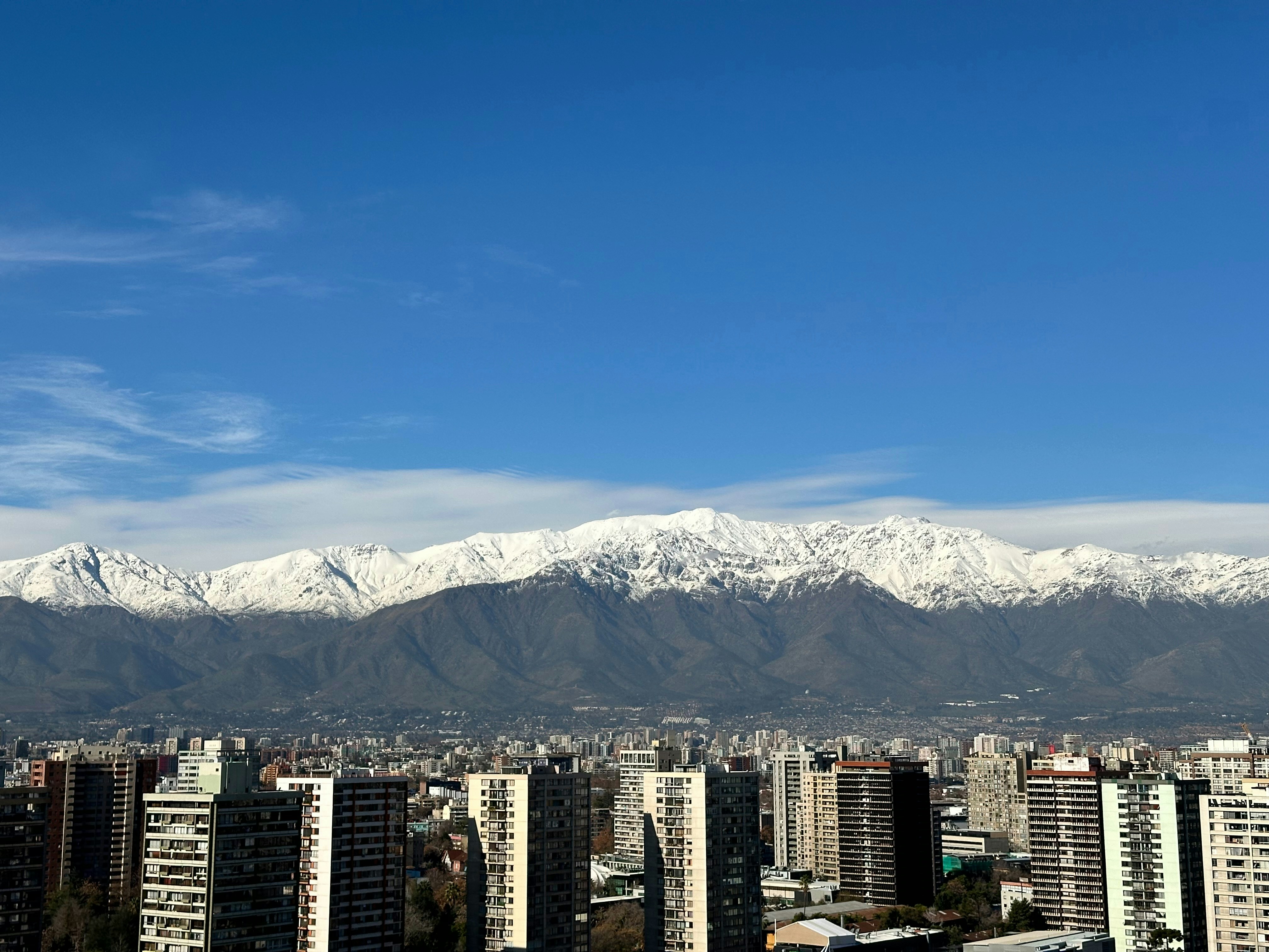 A view of a city with mountains in the background