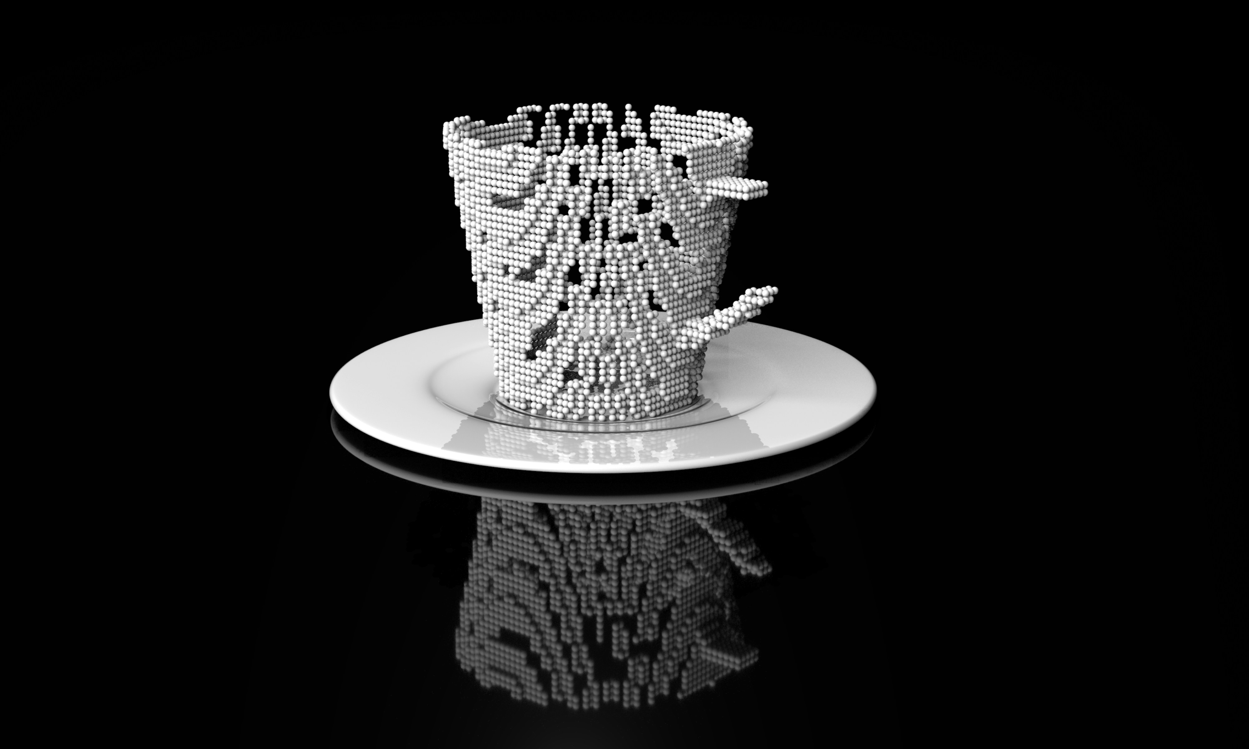 A black and white photo of a cup and saucer