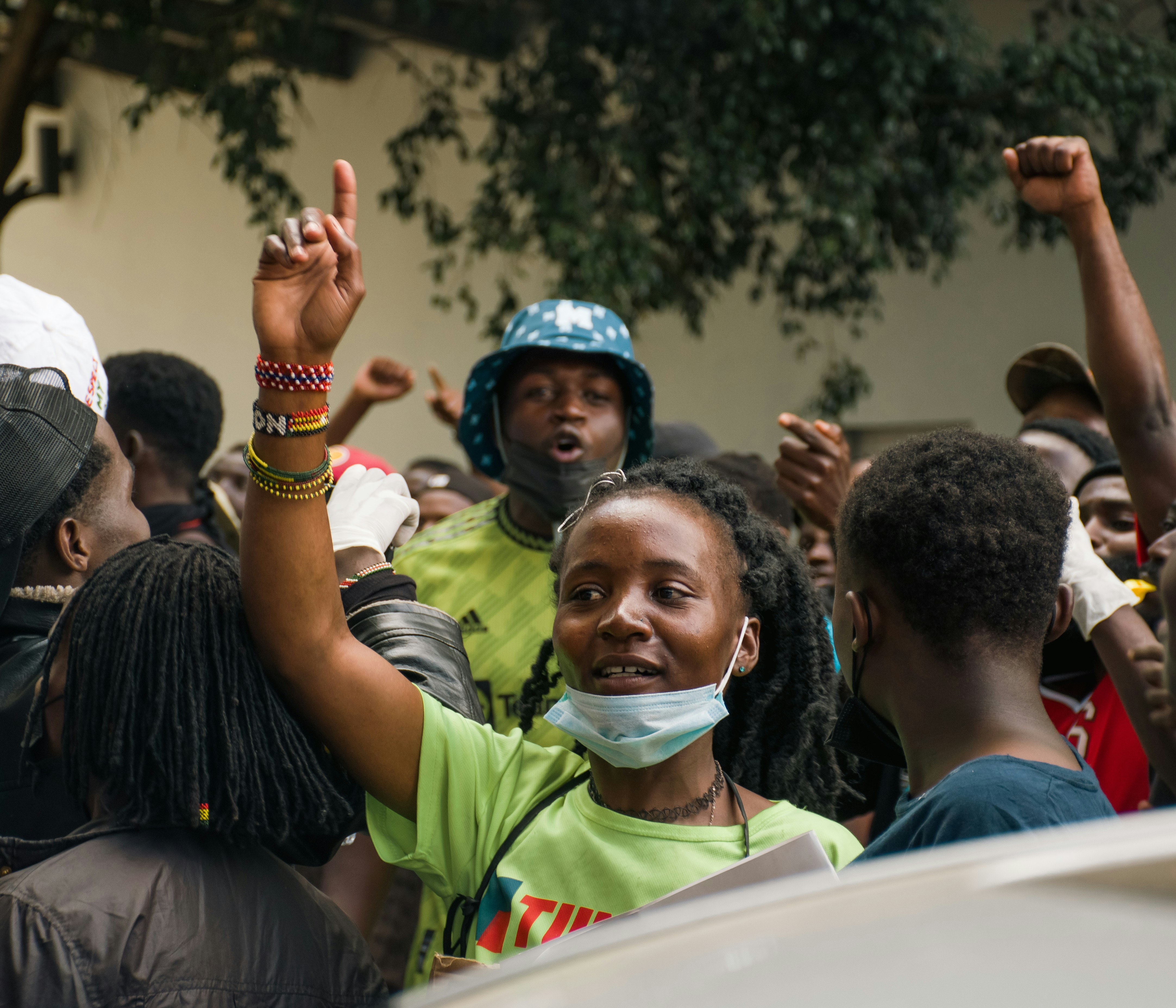 A group of people standing around each other