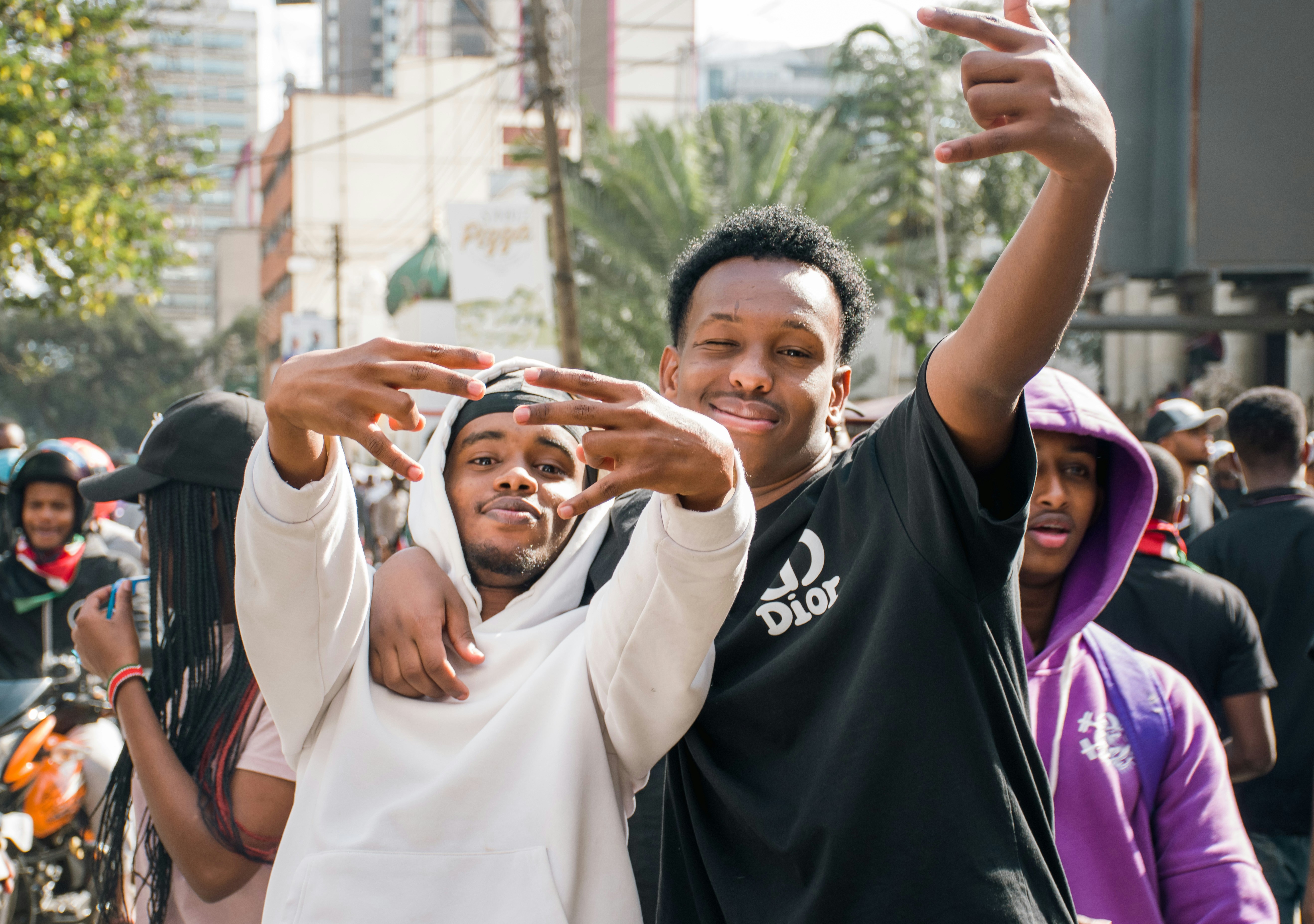 A man and a woman standing in front of a crowd of people