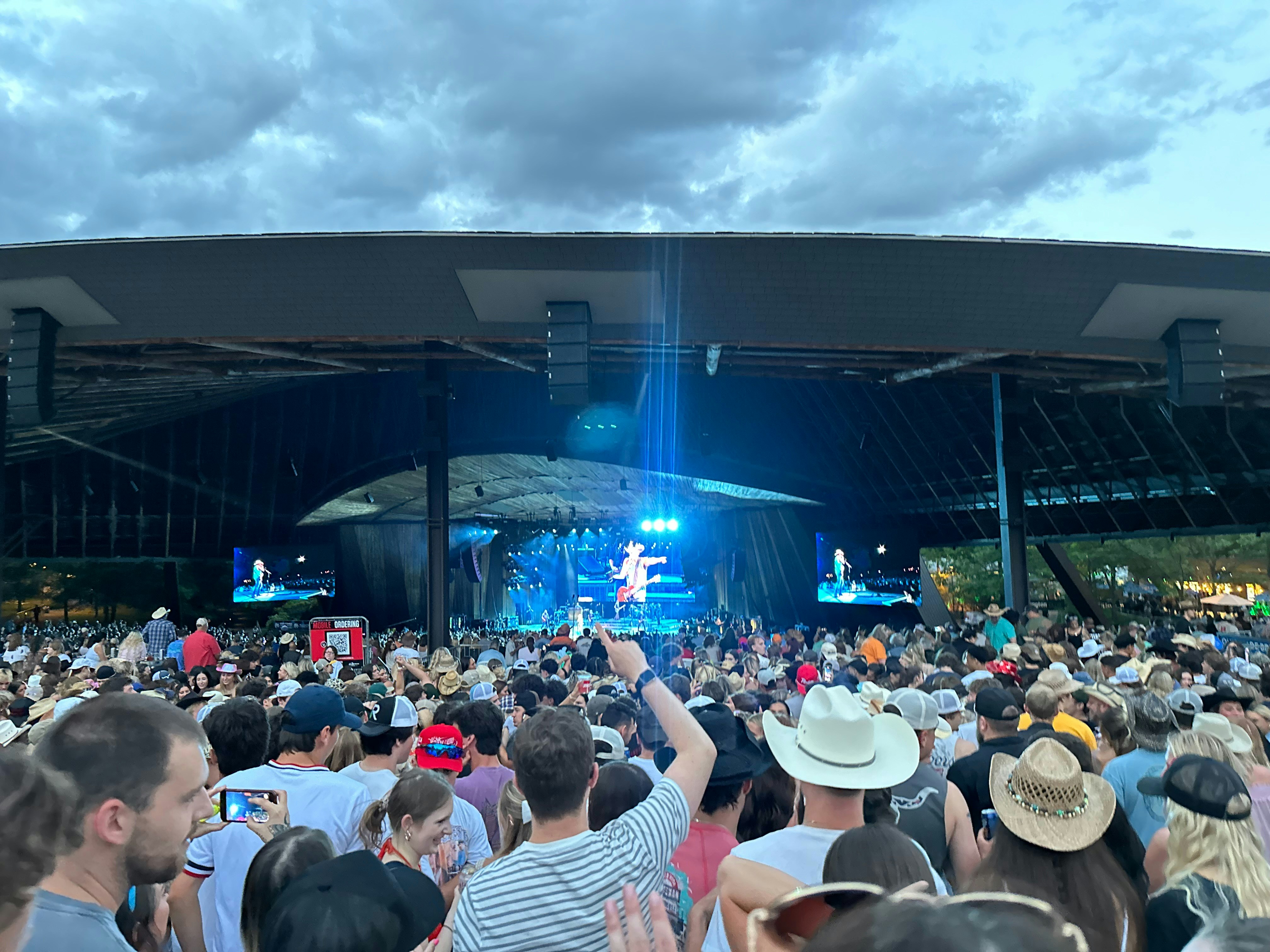 Country music festival stage with crowd at night in regional Australian town