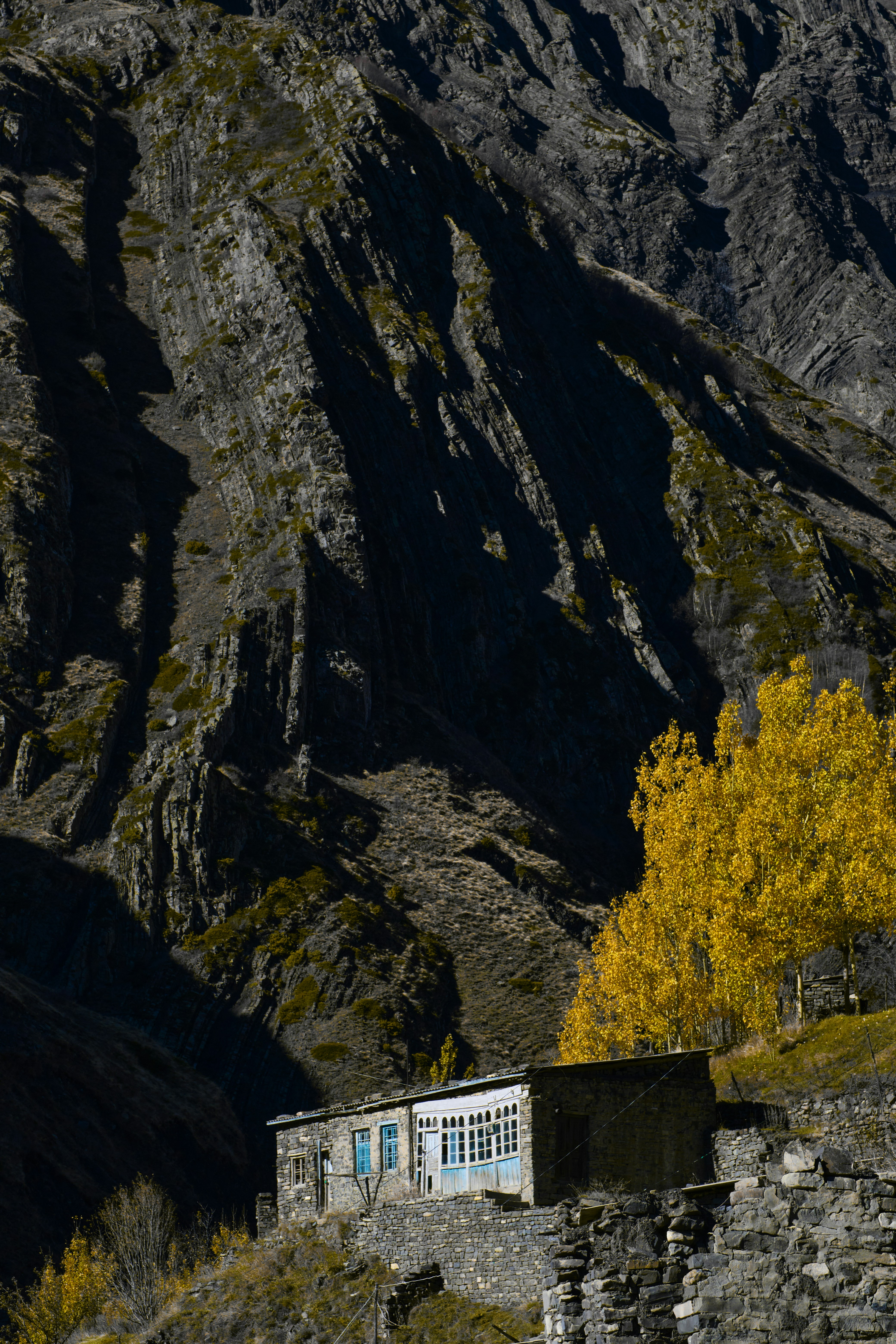 A small building in the middle of a mountain range
