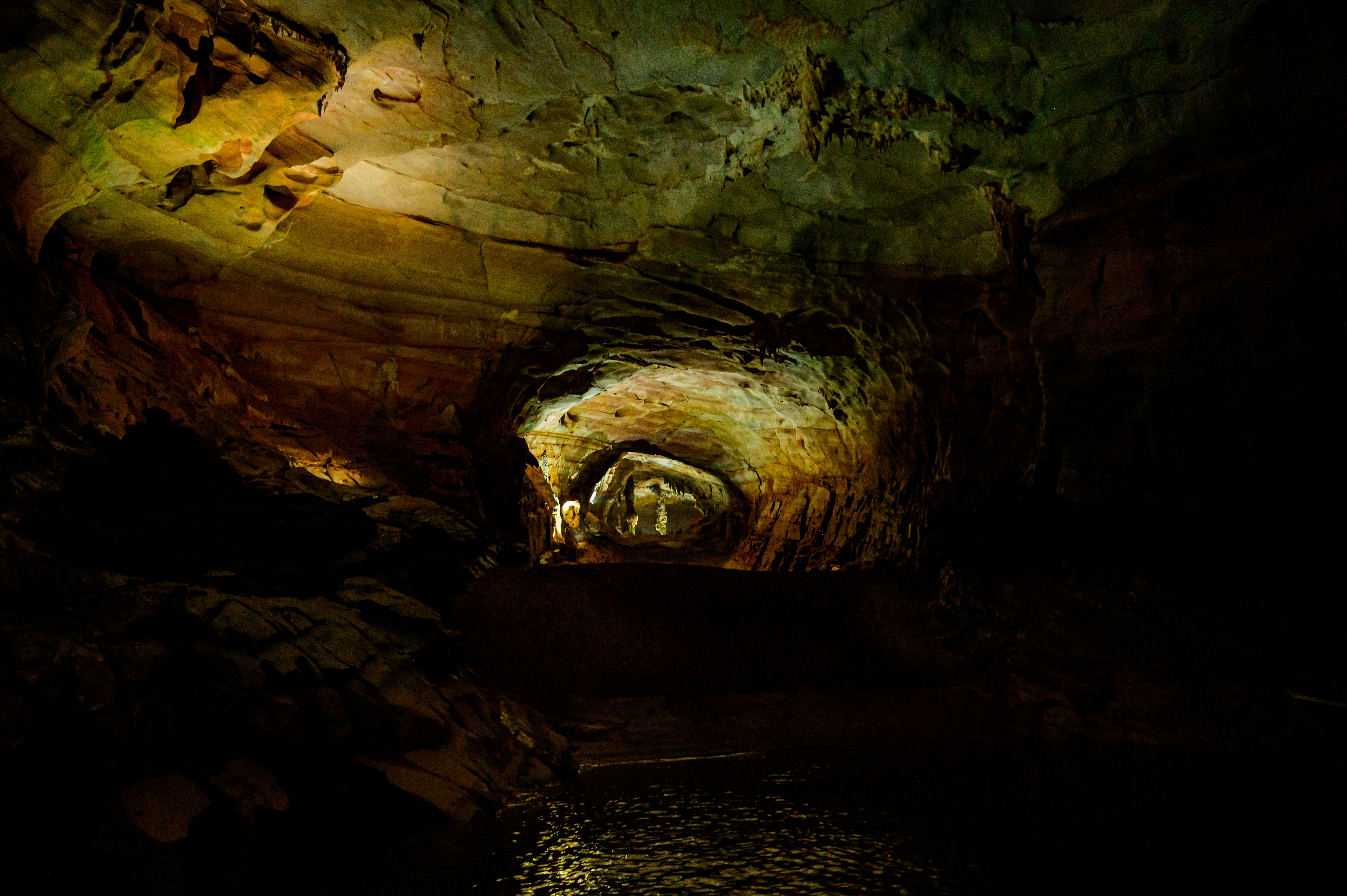 A dark cave with a light at the end of it