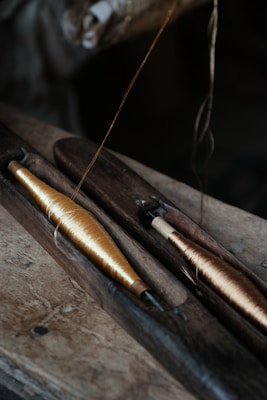 A close up of a fishing pole with a fishing hook