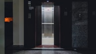 An elevator with a door open in a building