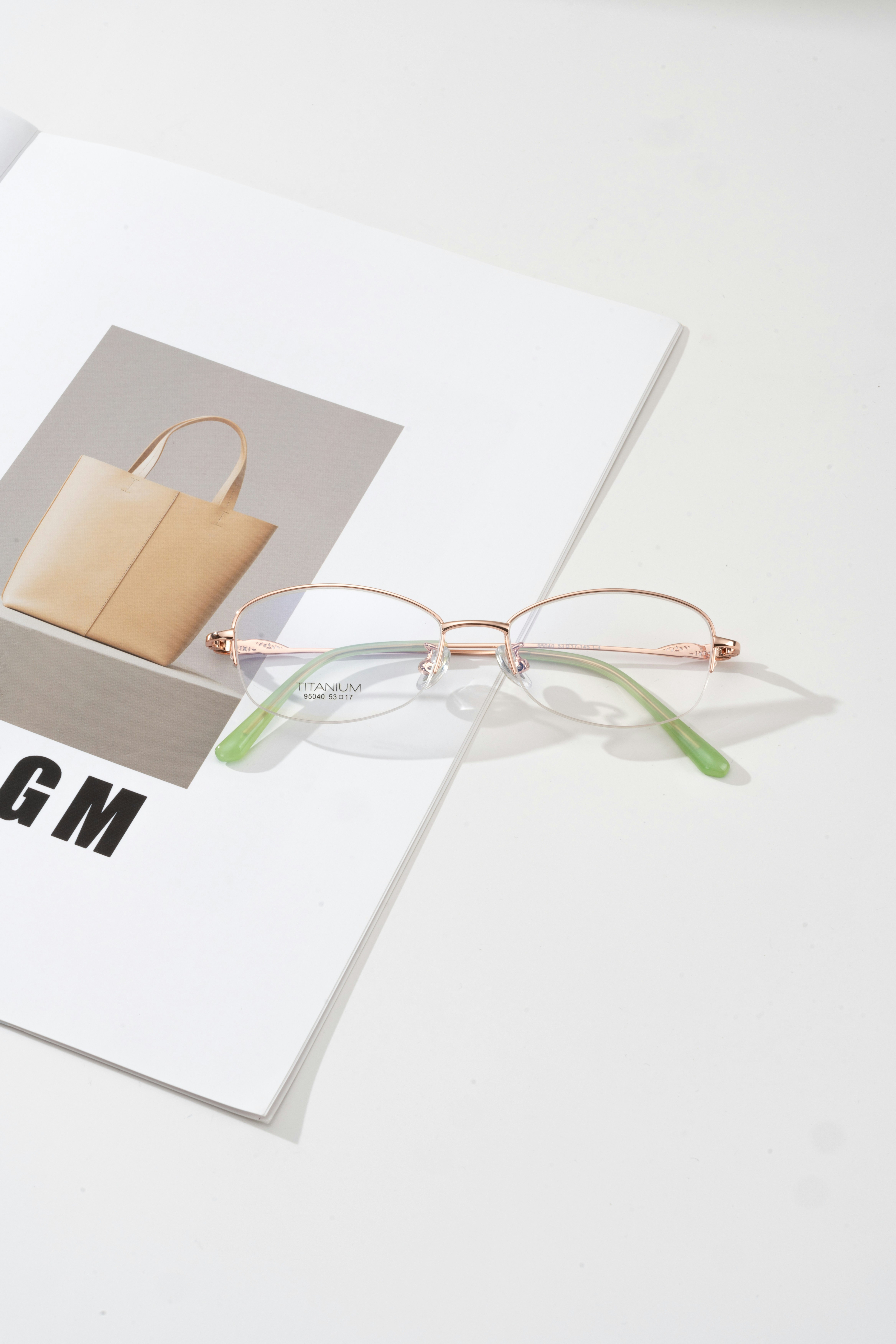A pair of glasses sitting on top of a book
