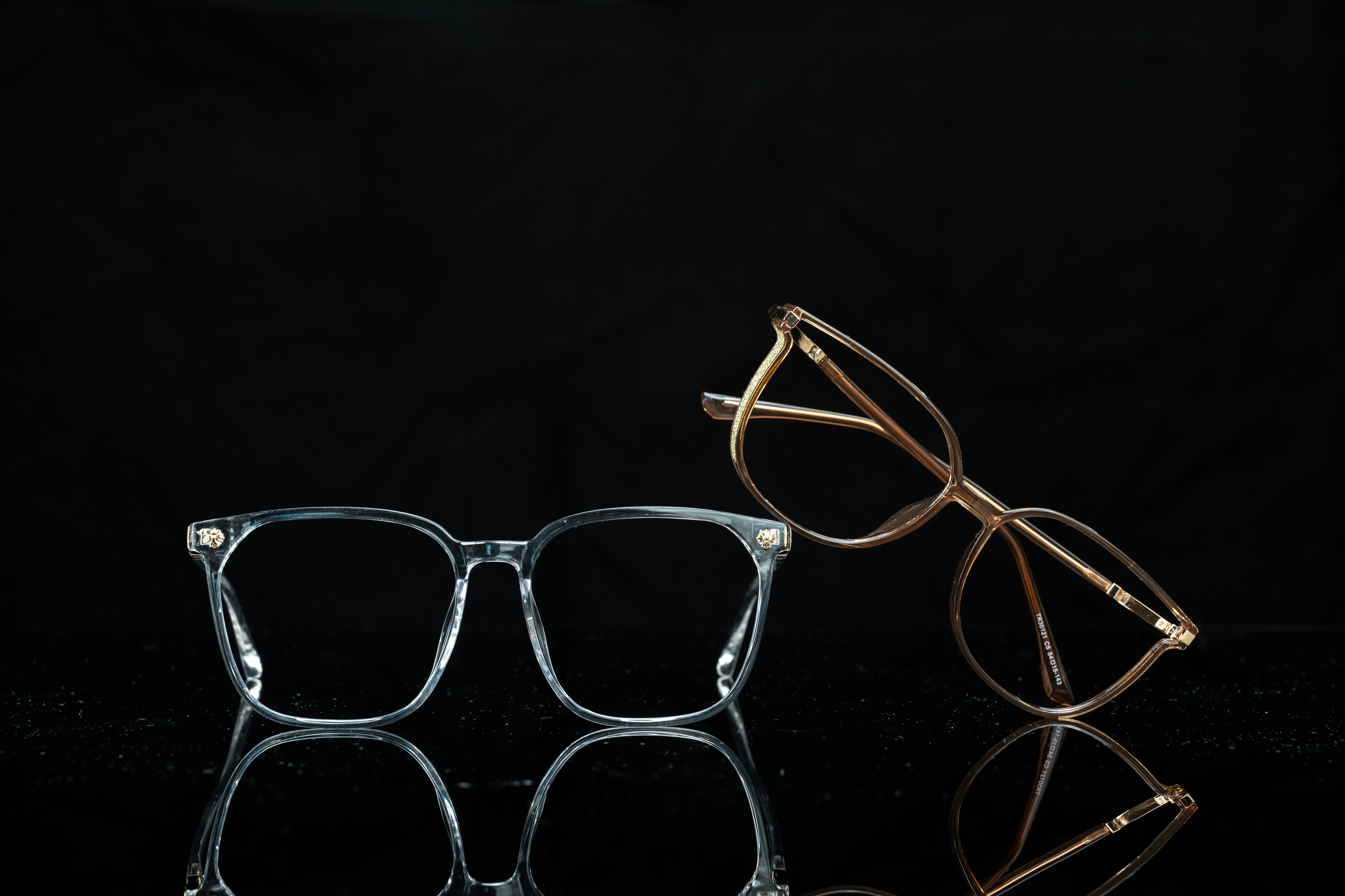 A pair of glasses sitting on top of a table