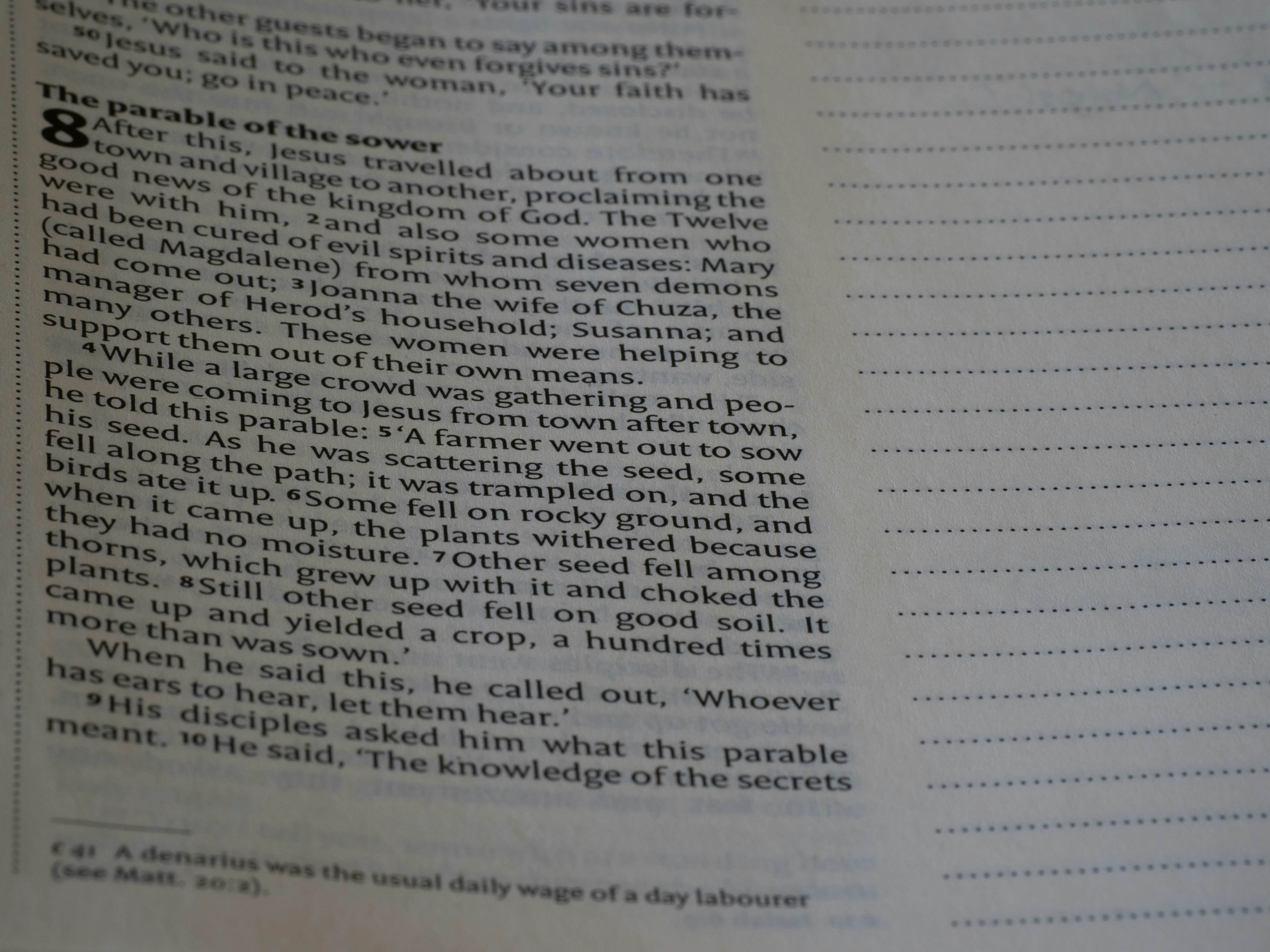 A close up of an open book with writing on it