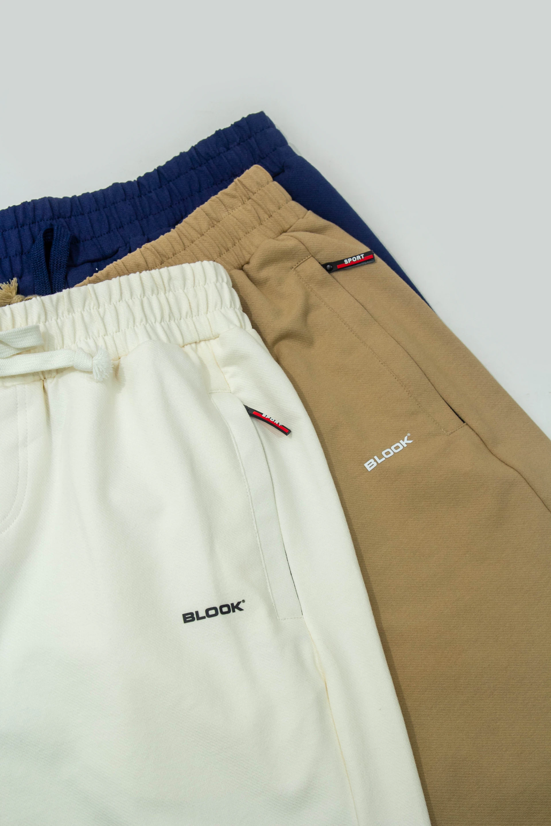 A group of three men's shorts sitting next to each other