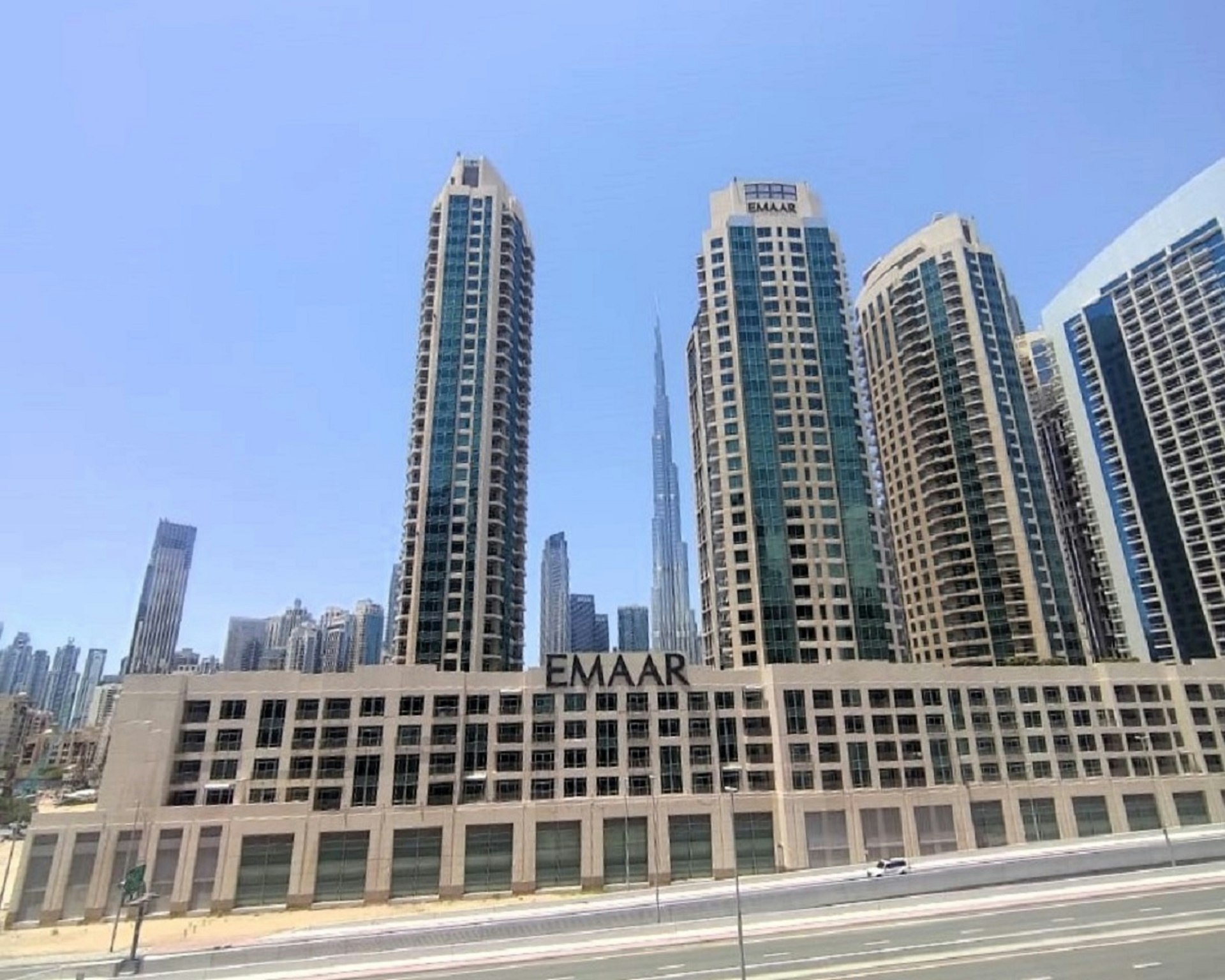 A group of tall buildings sitting next to each other